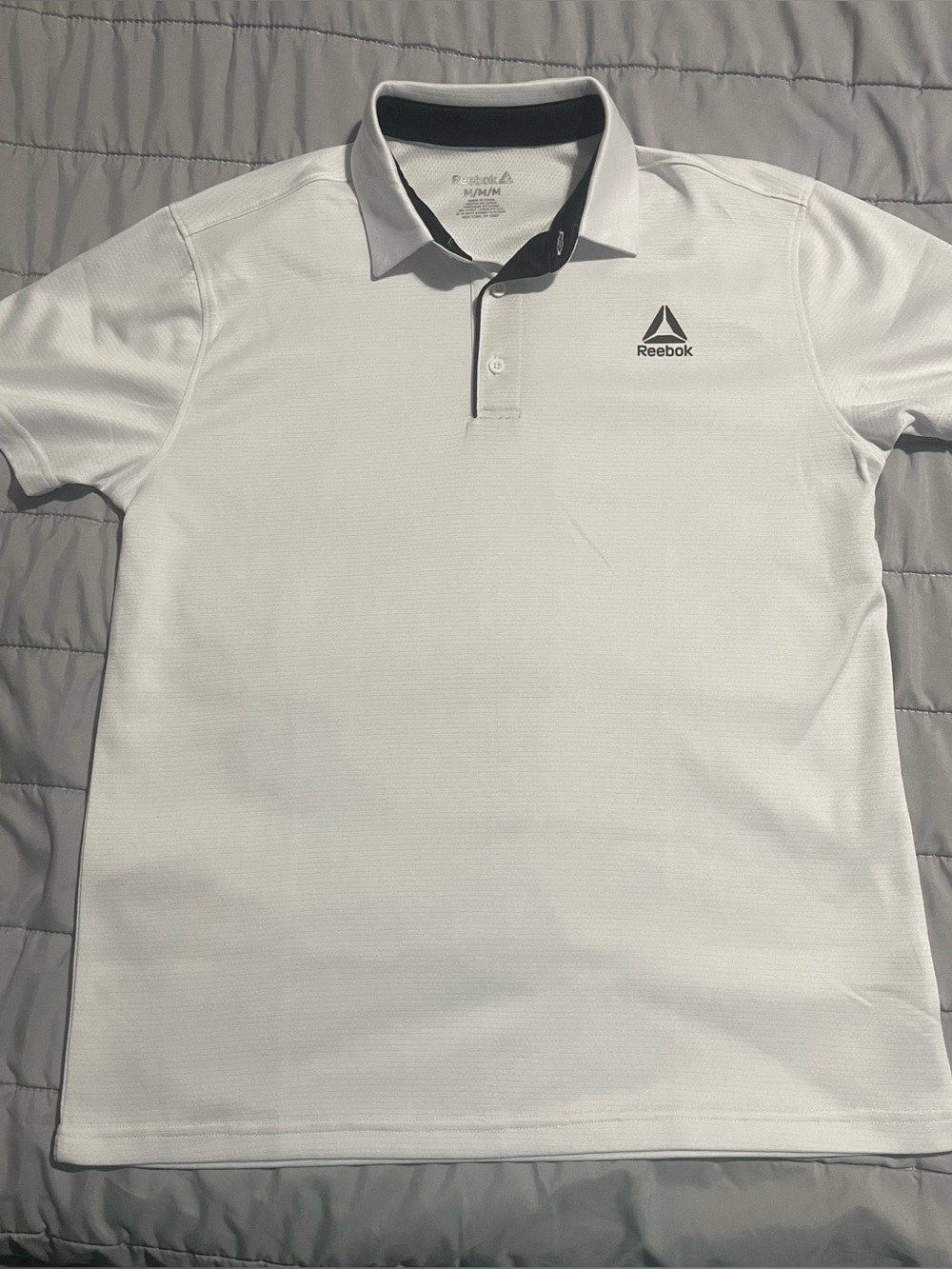 Two Reebok polo shirts